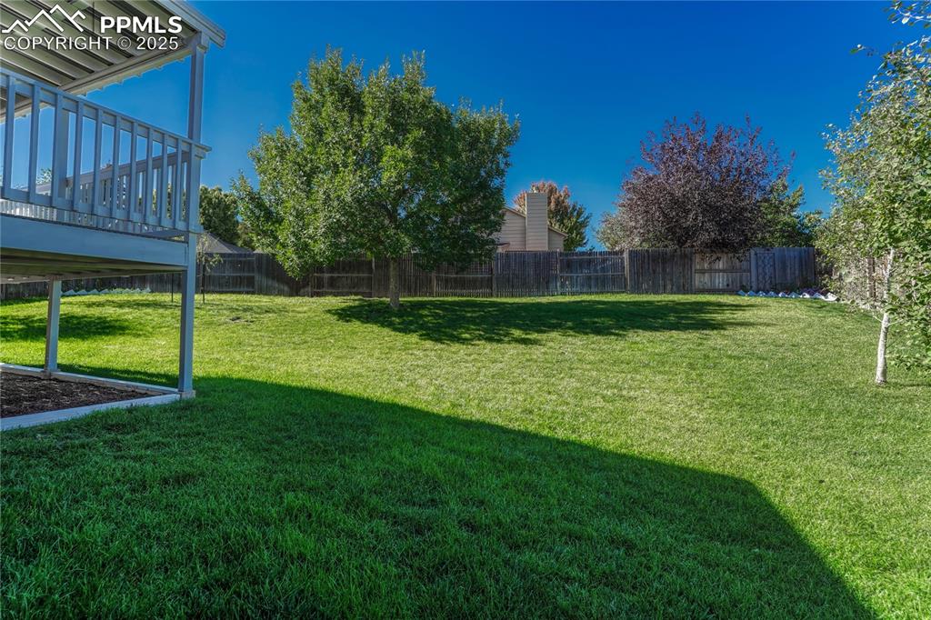 Image 47 of 50: Large Manicured Backyard