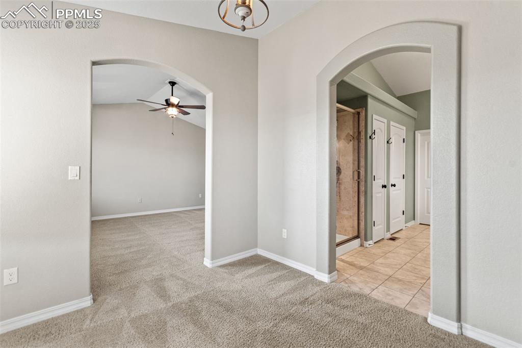 Image 26 of 45: Primary bedroom with sitting area and attached bath