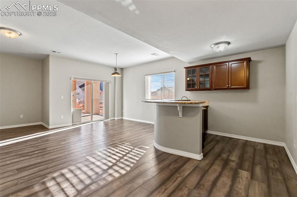 Image 30 of 45: Lower level wet bar perfect for entertaining.