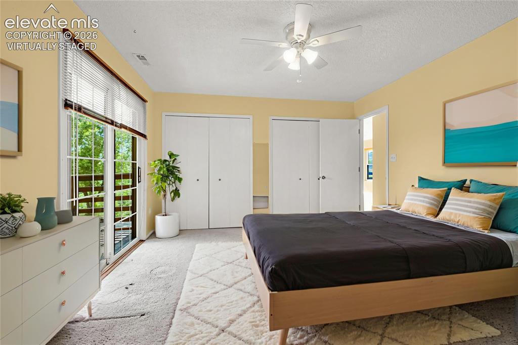 Image 11 of 33: mountain views from the deck off of the master bedroom - virtually staged