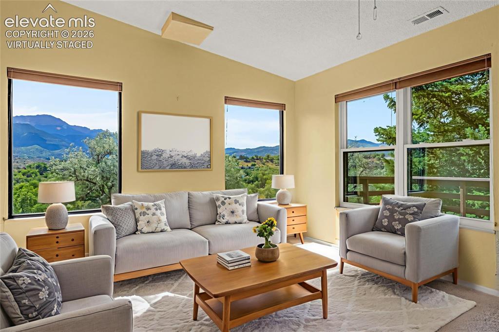 Image 2 of 33: Amazing mountain views from the family room - virtually staged