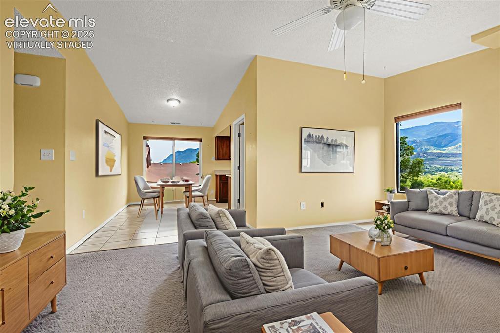 Image 4 of 33: views of the mountains from the dining area - virtually staged