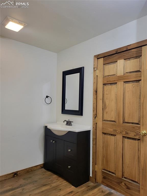 Image 17 of 43: The property features a dark wood vanity with a white countertop and an int