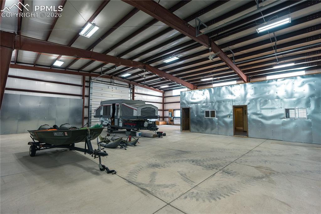 Image 24 of 42: Spacious commercial building featuring a large open area, a high ceiling wi
