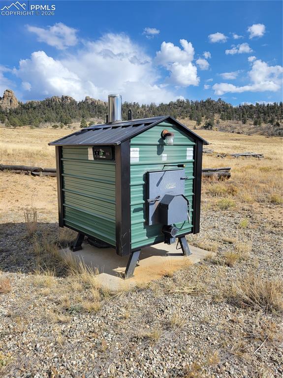 Image 6 of 42: Outdoor Woodmaster heating unit/wood boiler