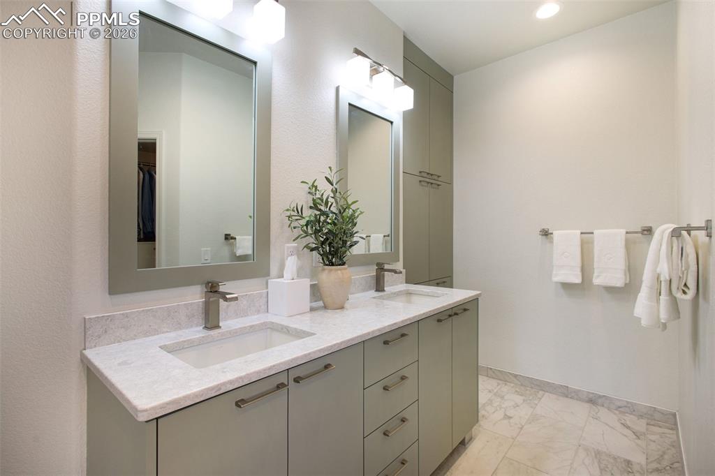 Image 29 of 45: Dual sinks with extra storage