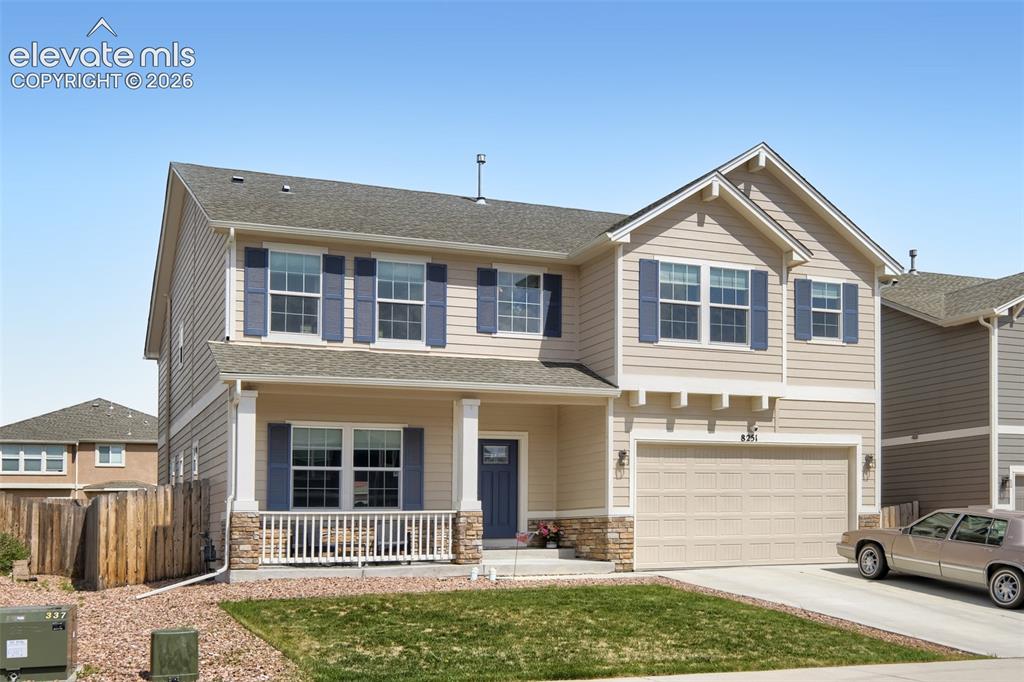 Image 1 of 32: Two-story residence featuring light-toned siding, blue window shutters, and