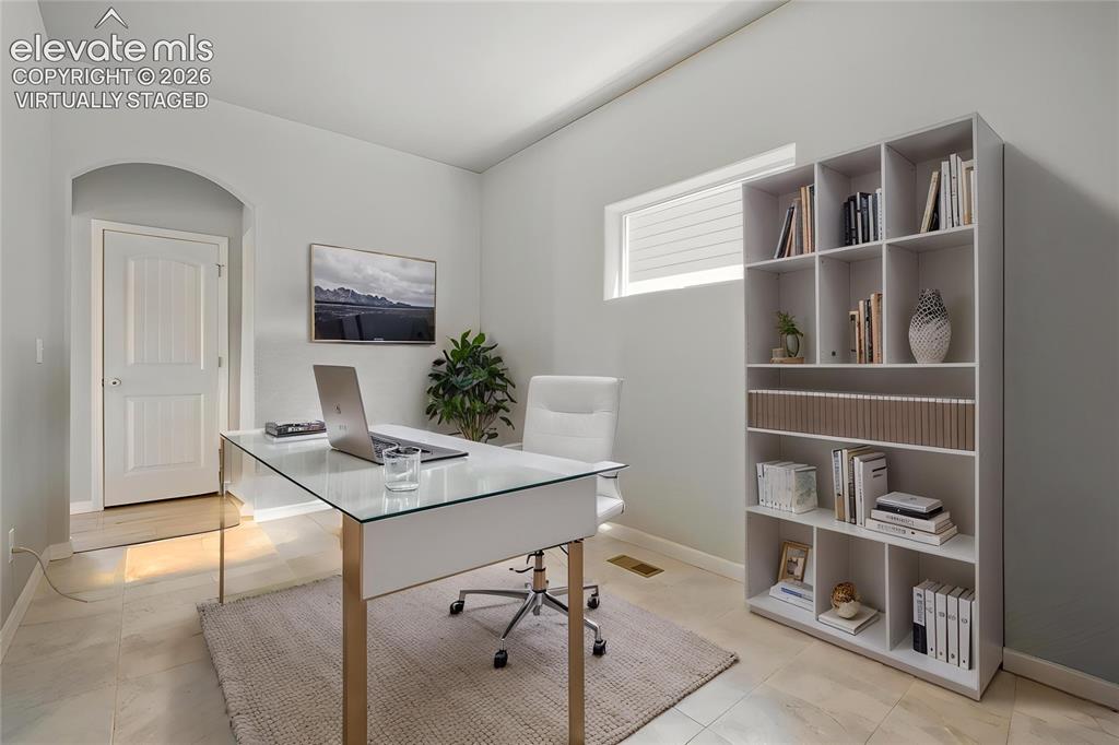 Image 6 of 33: Virtually Staged Dedicated room featuring neutral walls and light-toned til