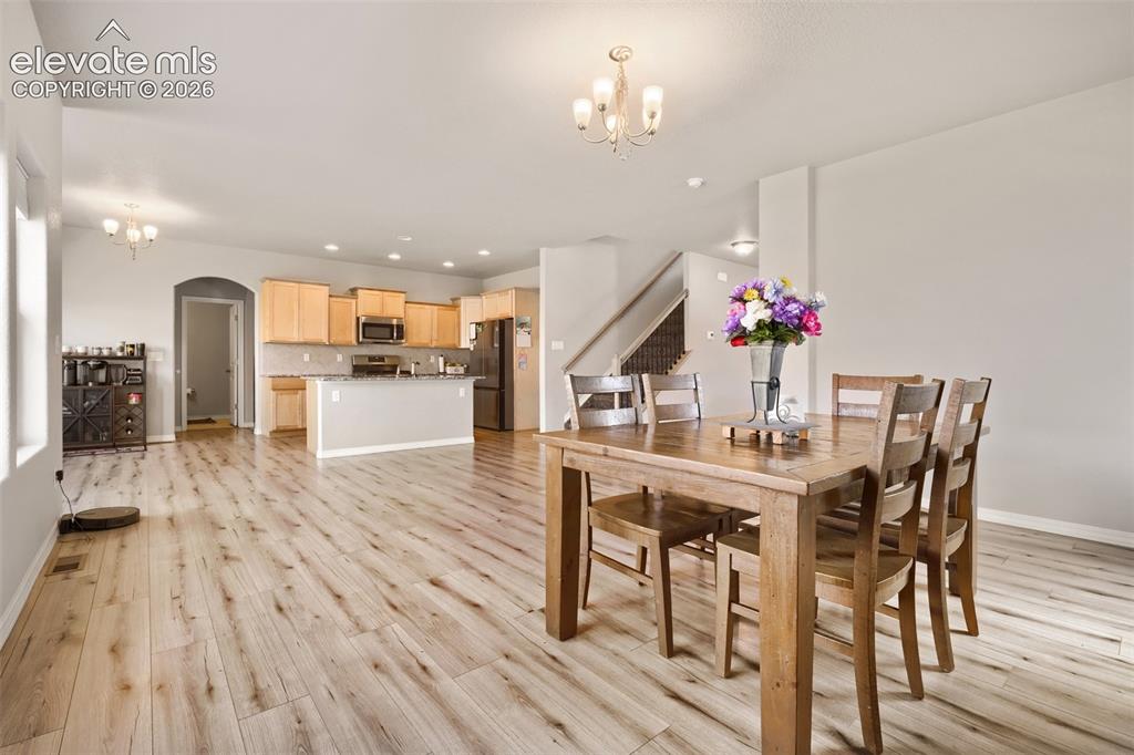 Image 7 of 32: Kitchen featuring light wood cabinetry, granite countertops, and stainless