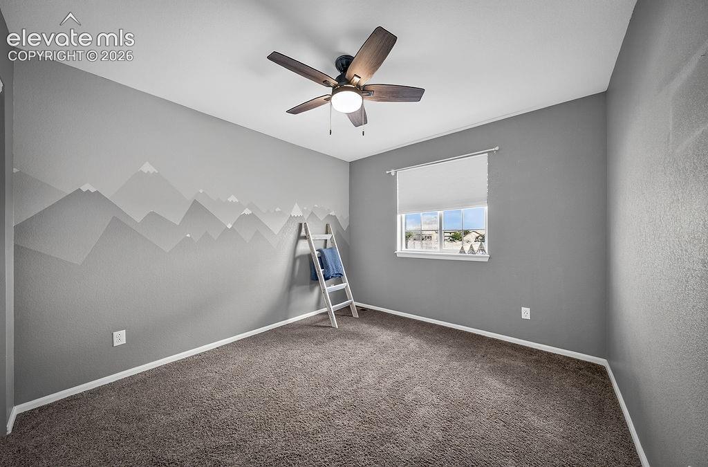 Image 32 of 50: Wall-to-wall carpeting, ceiling fan with integrated lighting, and a single 