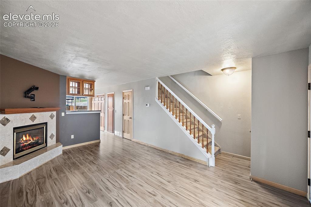 Image 8 of 29: Kitchen featuring wood cabinetry, stainless steel appliances, granite count