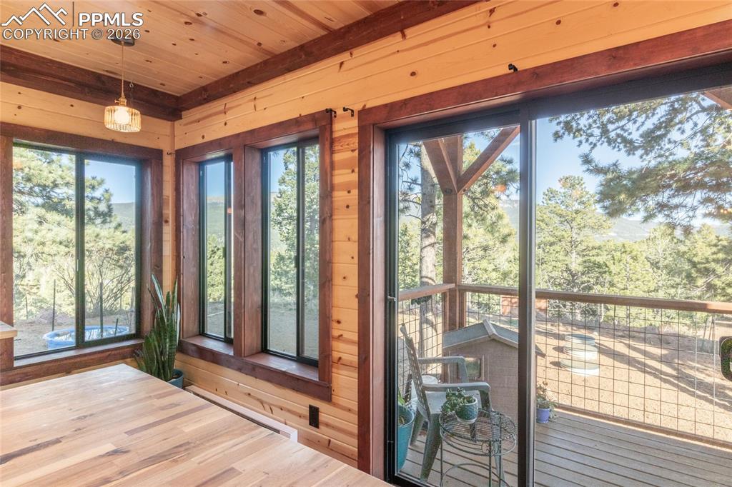 Image 10 of 39: Kitchen Balcony to Fenced Yard.