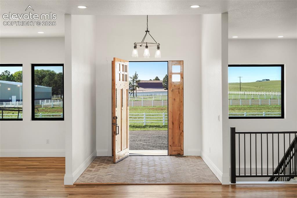 Image 10 of 41: White interior walls with recessed lighting