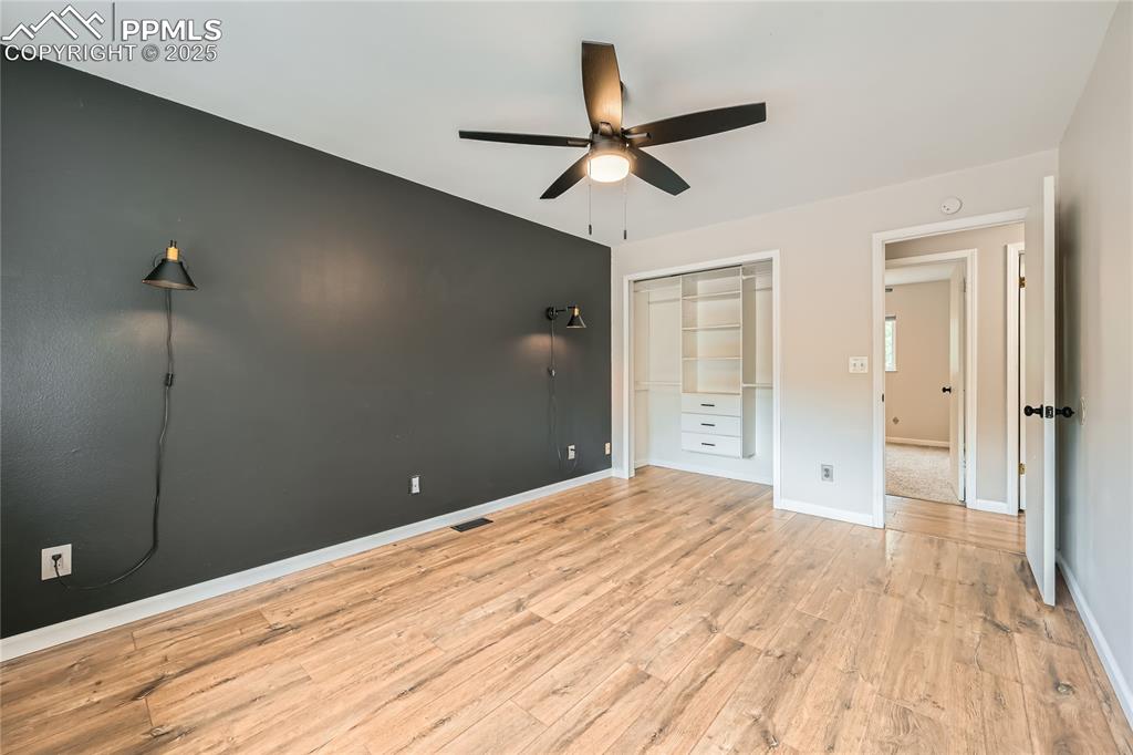 Image 13 of 32: bedroom featuring light wood-style flooring, a closet, and ceiling fan
