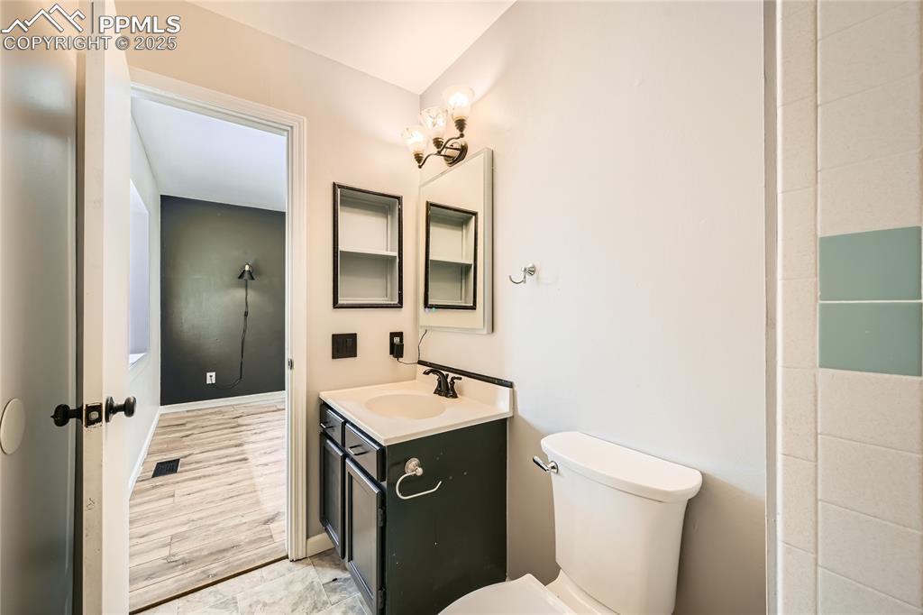 Image 15 of 32: Bathroom featuring vanity and toilet