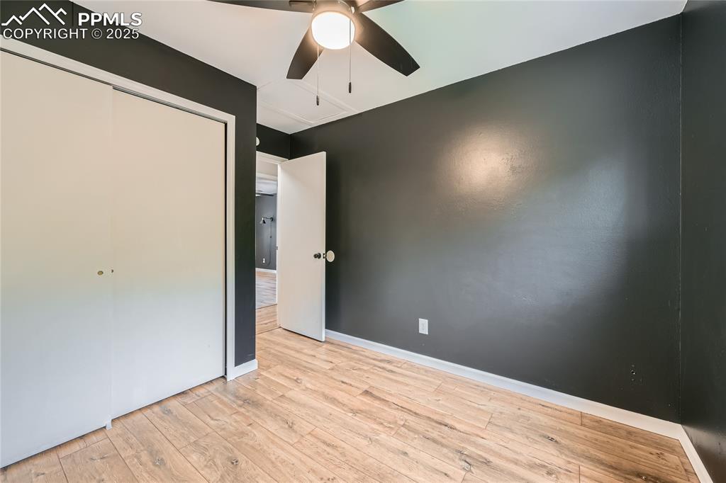 Image 17 of 32: Unfurnished bedroom with hardwood / wood-style floors, a closet, and a ceil