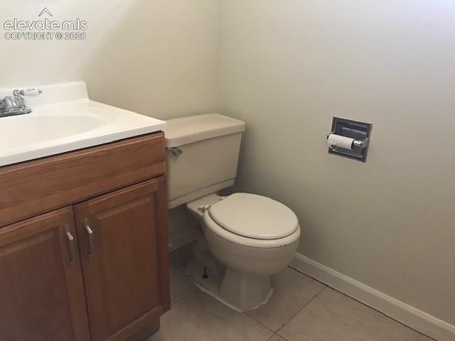 Image 17 of 18: White vanity with a single basin sink, chrome faucet, and wood-finish cabin