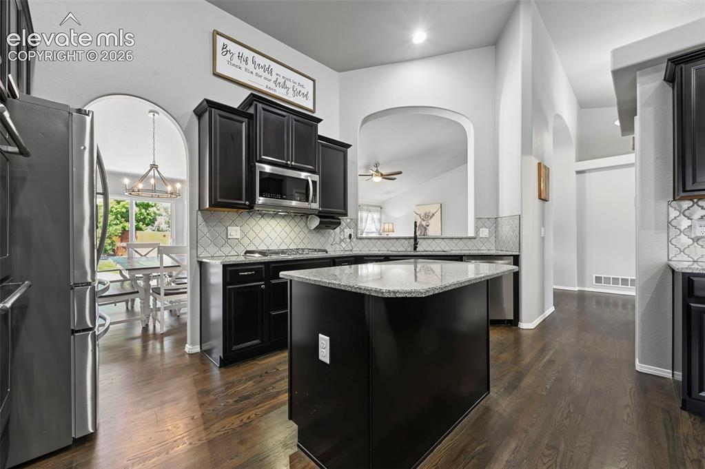 Image 13 of 50: Stunning designer gourmet kitchen w/ double ovens, coffee bar, stainless ap