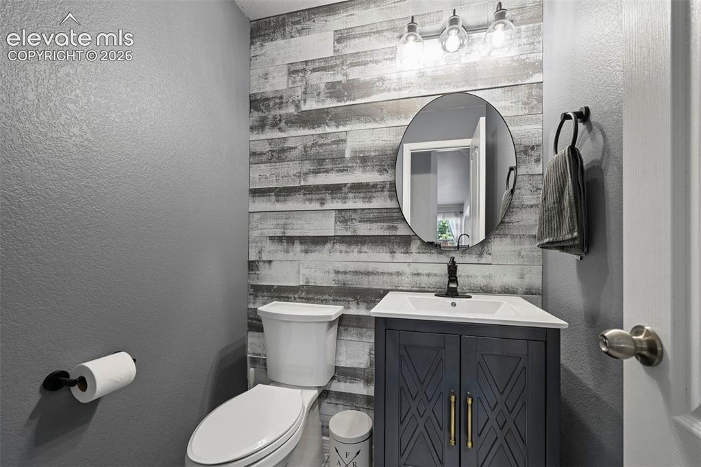 Image 16 of 50: Main floor bathroom, adjacent to kitchen 