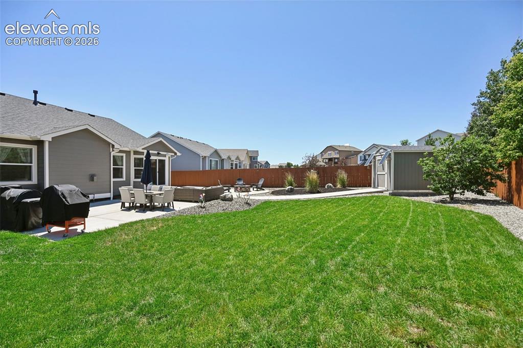 Image 44 of 50: Designer professionally landscaped yard w/ walkway to solar shed, extended 