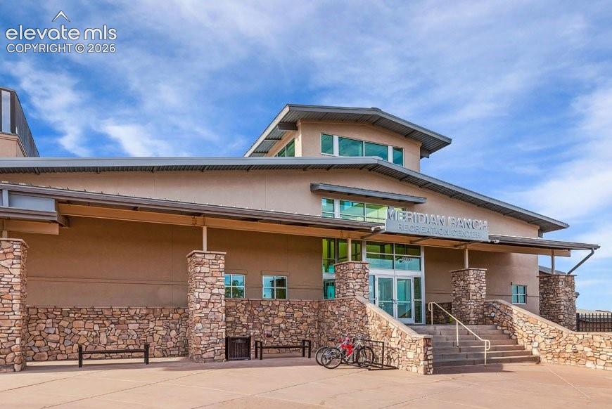 Image 46 of 50: Community rec center w/ indoor & outdoor pools, steam room, basketball cour