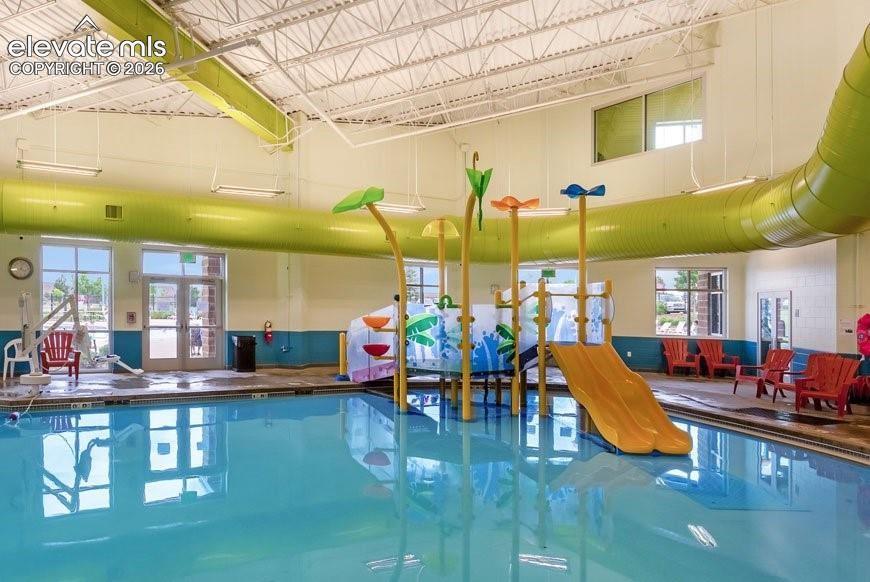 Image 48 of 50: Community rec center w/ indoor & outdoor pools, steam room, basketball cour