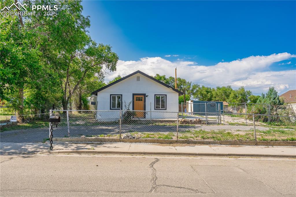 Image 2 of 35: Bungalow with a fenced front yard