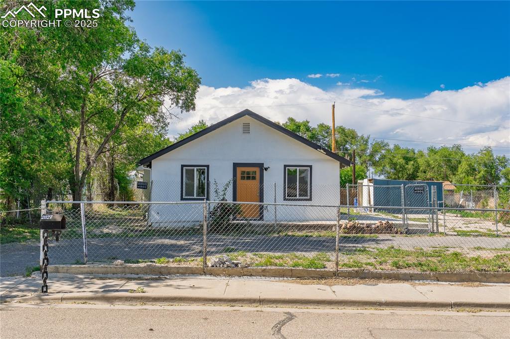 Image 33 of 35: Bungalow featuring a fenced front yard