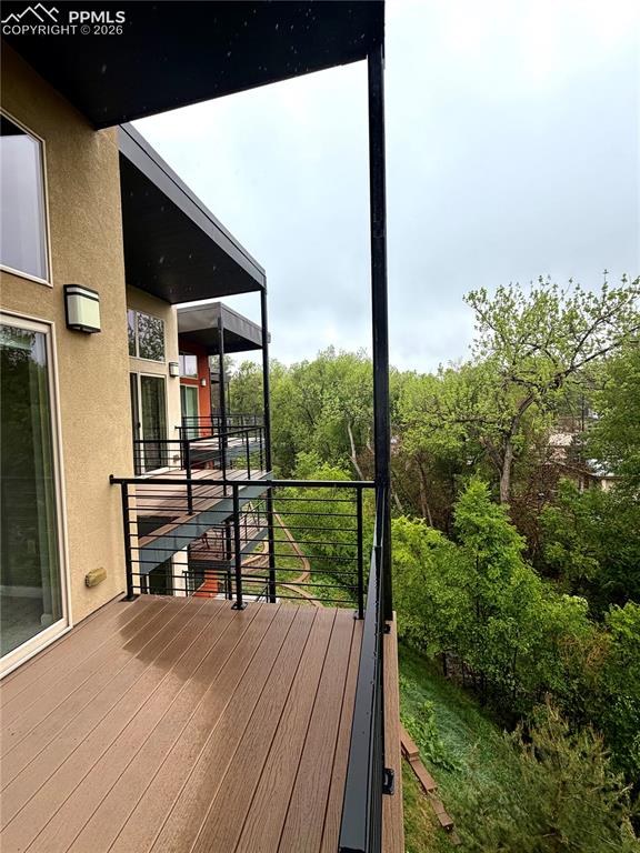 Image 10 of 28: Deck views off the living room