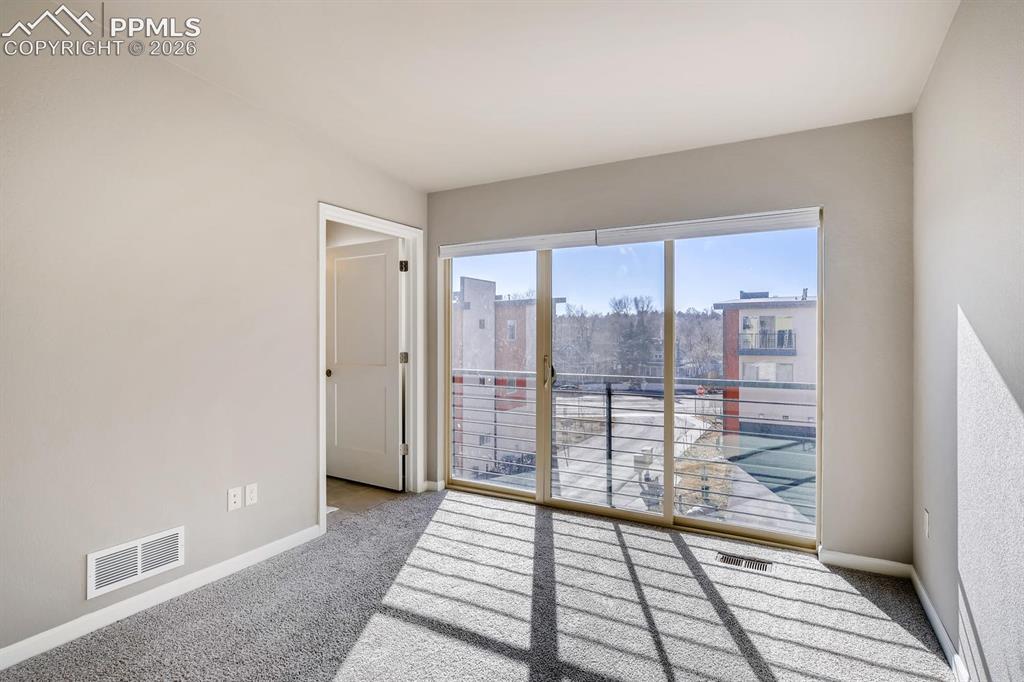 Image 18 of 28: Upstairs secondary bedroom