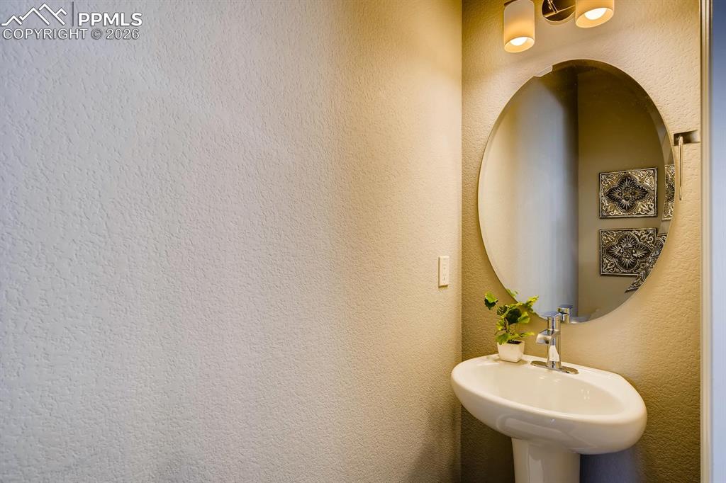 Image 8 of 29: Powder bath off of kitchen