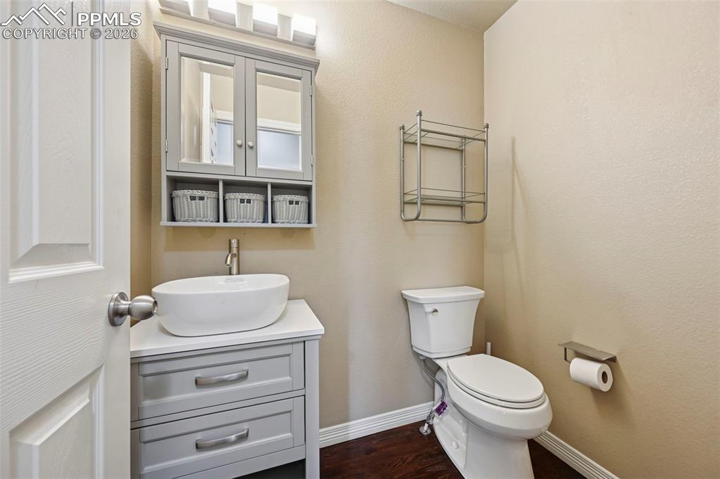 Image 18 of 38: Guest half bathroom, main level