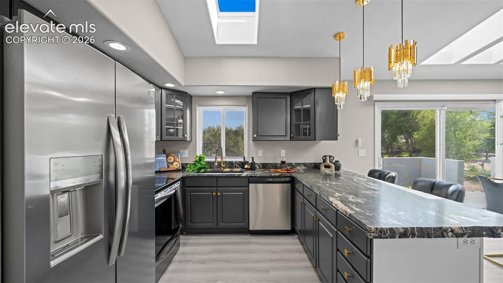 Image 13 of 48: New stainless-steel appliances