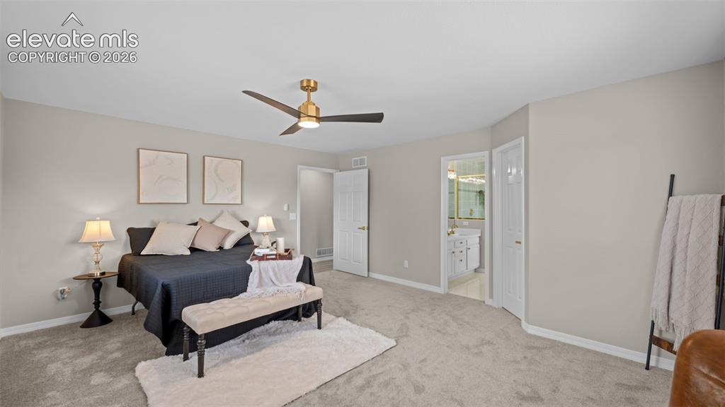 Image 24 of 48: Spacious room featuring neutral paint, light gray carpeting, and a modern c