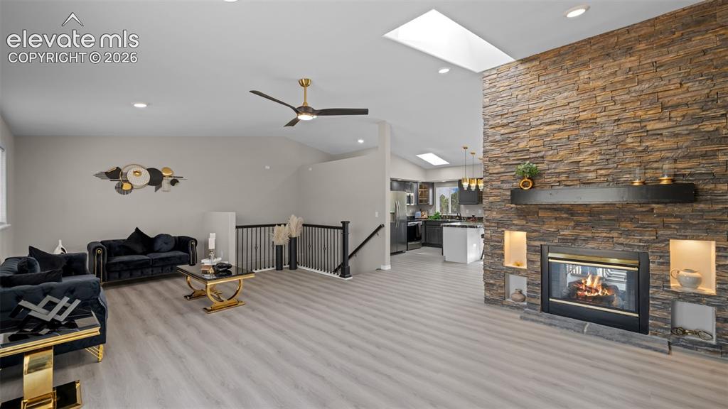 Image 8 of 48: Vaulted ceilings with skylights and recessed lighting illuminate this open