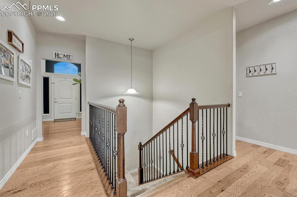 Image 5 of 46: Hallway with an upstairs landing, light wood-style flooring, recessed light