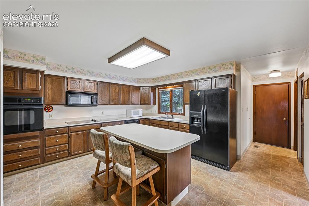 Image 13 of 30: ample cabinetry and island