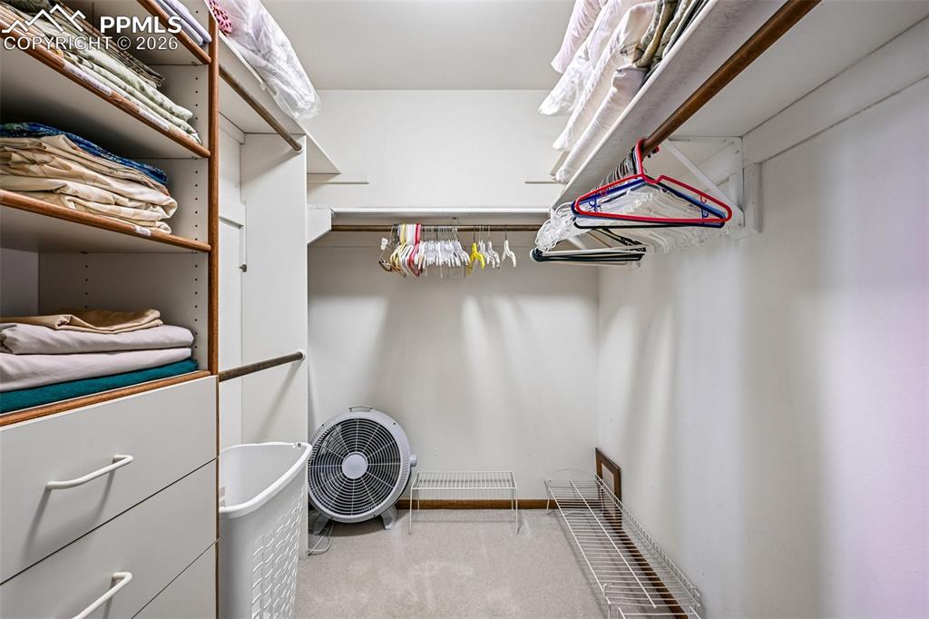 Image 18 of 30: Incredible walk in closet