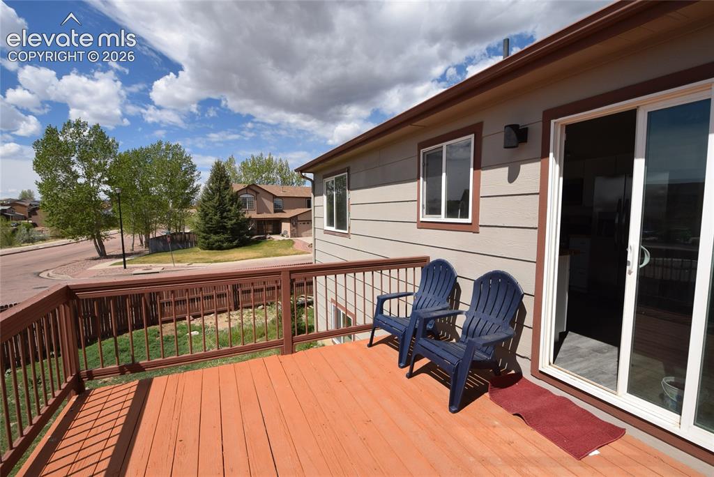 Image 3 of 45: Expansive wood deck with a full railing system