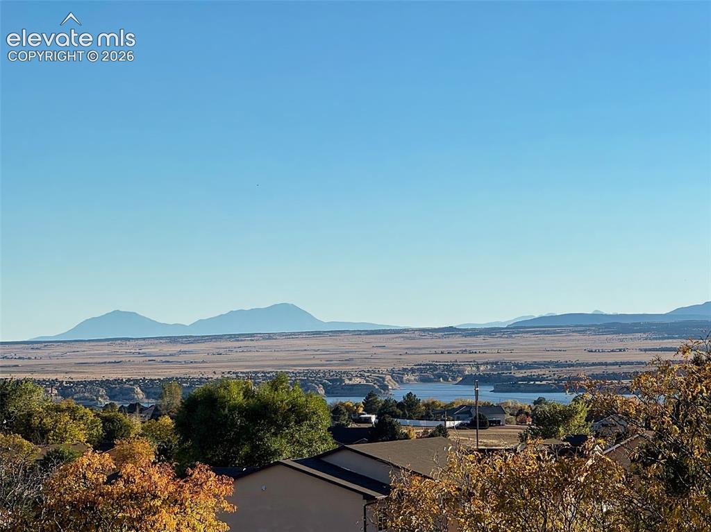 Image 4 of 50: Breathtaking vantage of the surrounding mountains and lake—capturing the tr