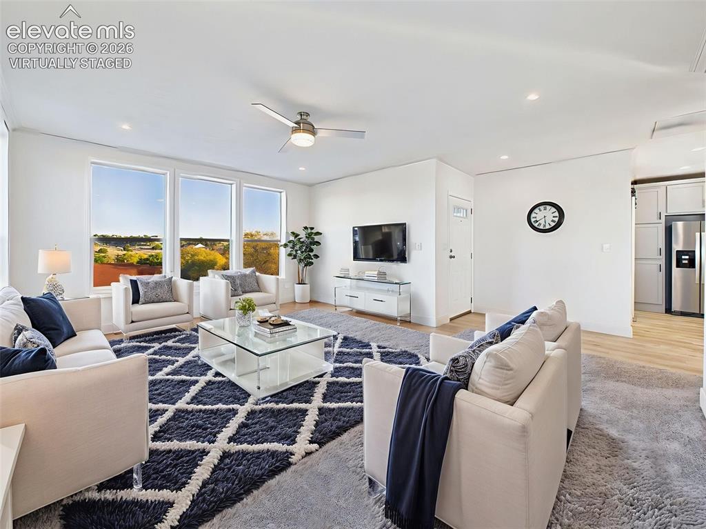Image 8 of 50: Virtually Staged the spacious great room—virtually staged to display furnit
