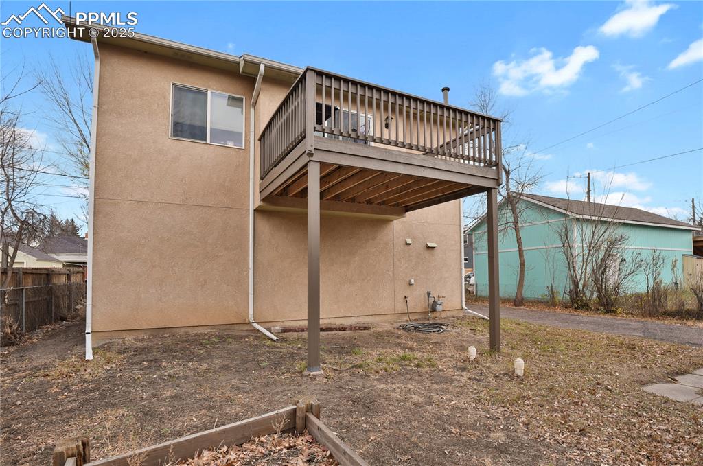 Image 29 of 31: Back deck and yard for apartment
