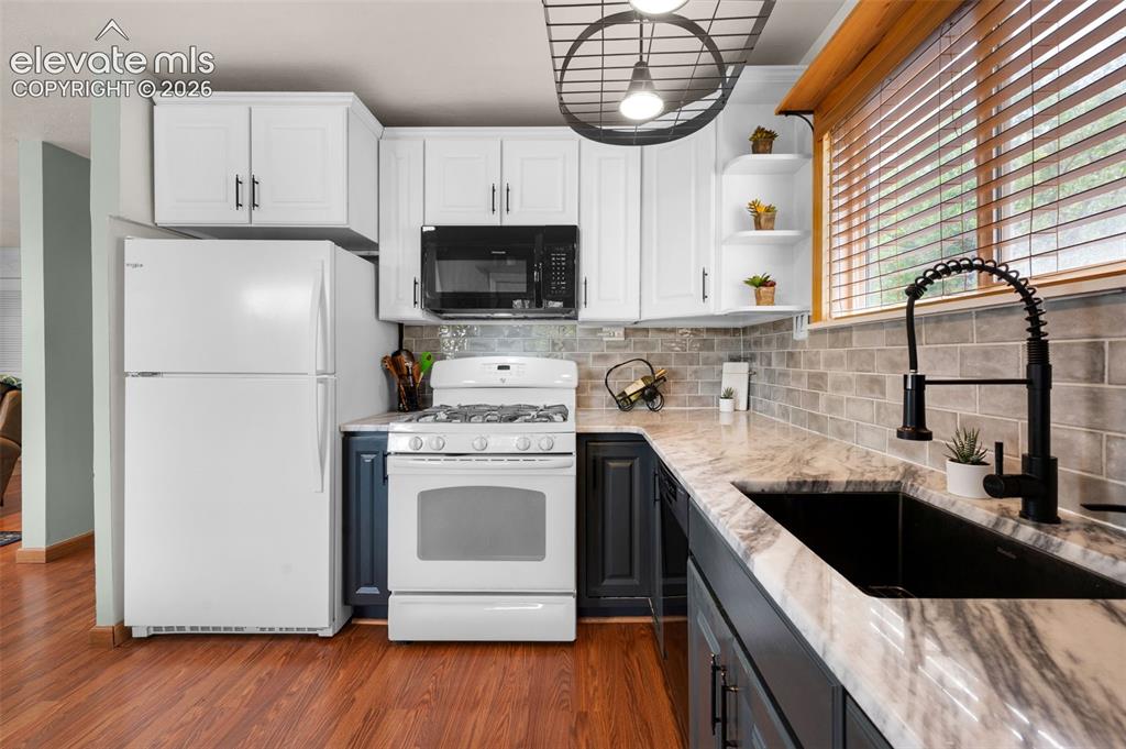 Image 3 of 28: Upper level kitchen