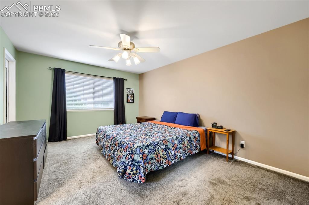 Image 17 of 32: Carpeted interior space featuring a window with horizontal blinds, a ceilin