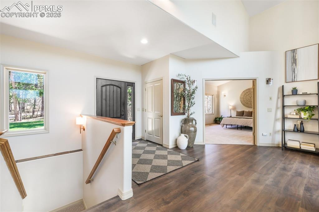 Image 10 of 50: Living space with soaring ceilings and expansive windows