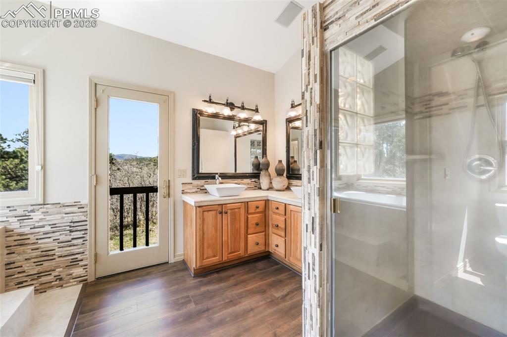 Image 15 of 50: Spacious room featuring vaulted ceilings, light-toned carpeting, transom wi