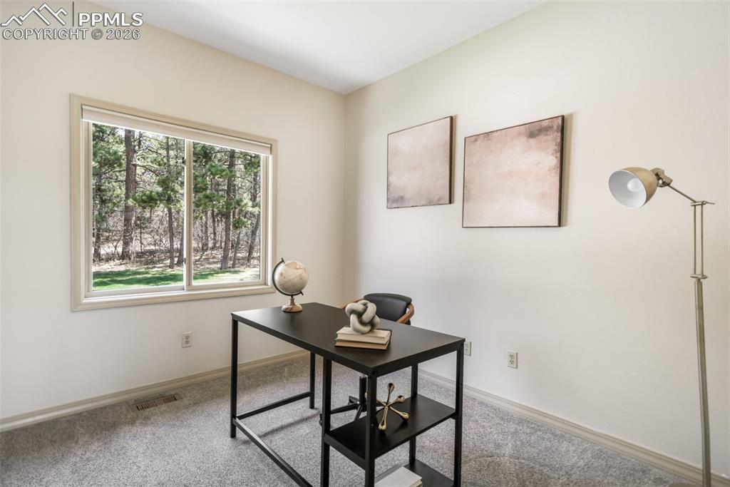 Image 22 of 50: Built-in jetted tub surrounded by a stone-look tile deck