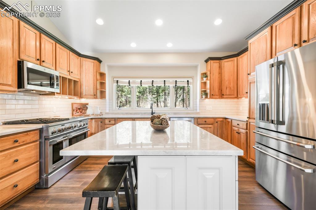 Image 26 of 50: Room featuring a large window, light-colored walls, and gray carpeting