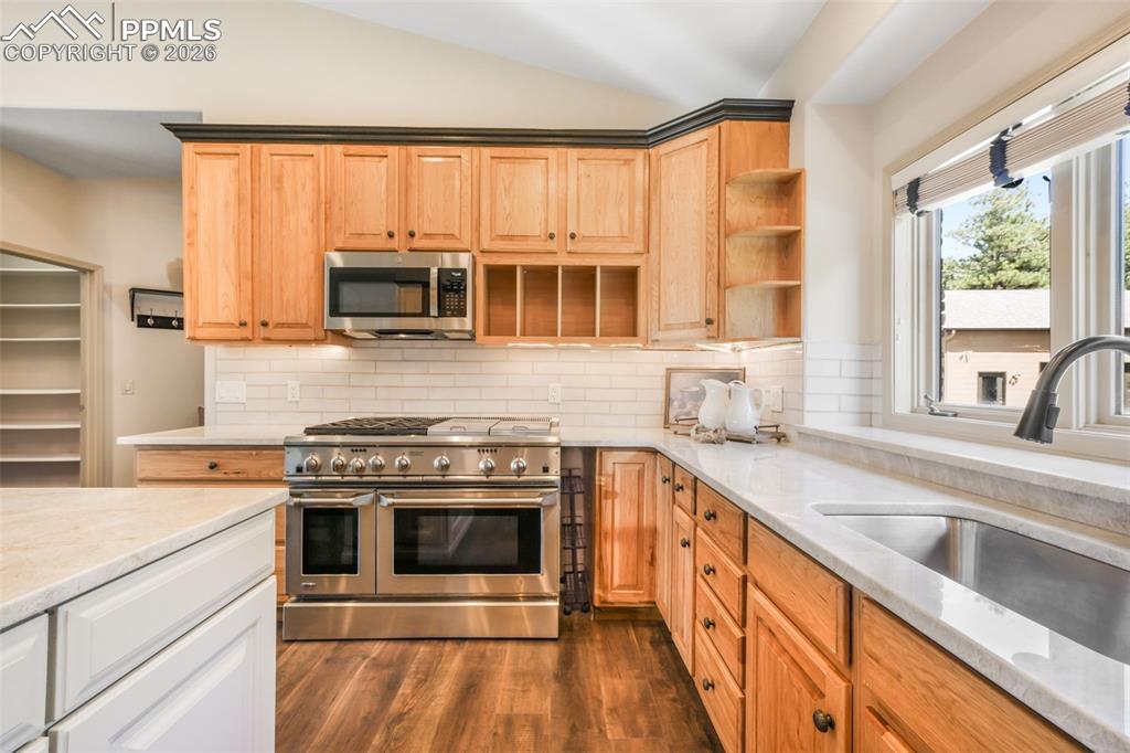Image 27 of 50: Interior room featuring light-colored walls and grey carpet flooring