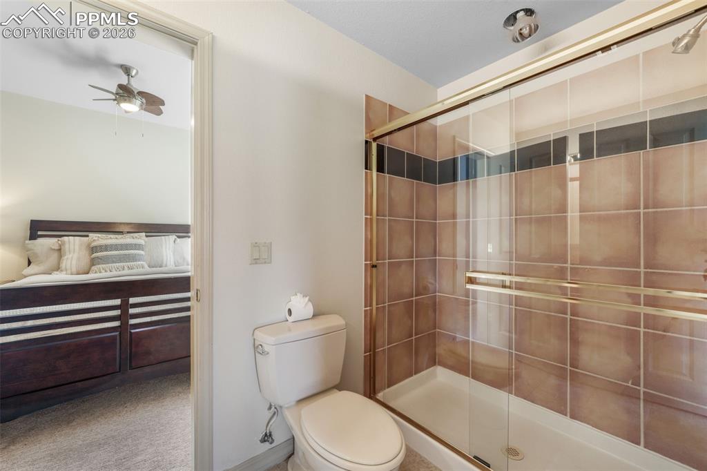 Image 36 of 50: Spacious living area featuring floor-to-ceiling windows, recessed lighting,